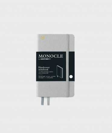 Libreta Monocle A6. Tapa dura gris. Acabado puntos
