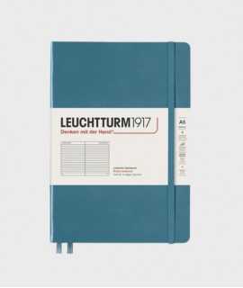 Medium A5 notebook. Blue hardcover. Finishing lines