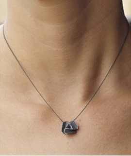 Molinets pendant, small. Oxide.